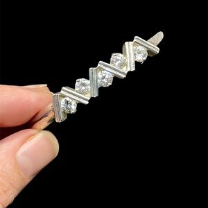 Silver tone bangle bracelet with cut crystals